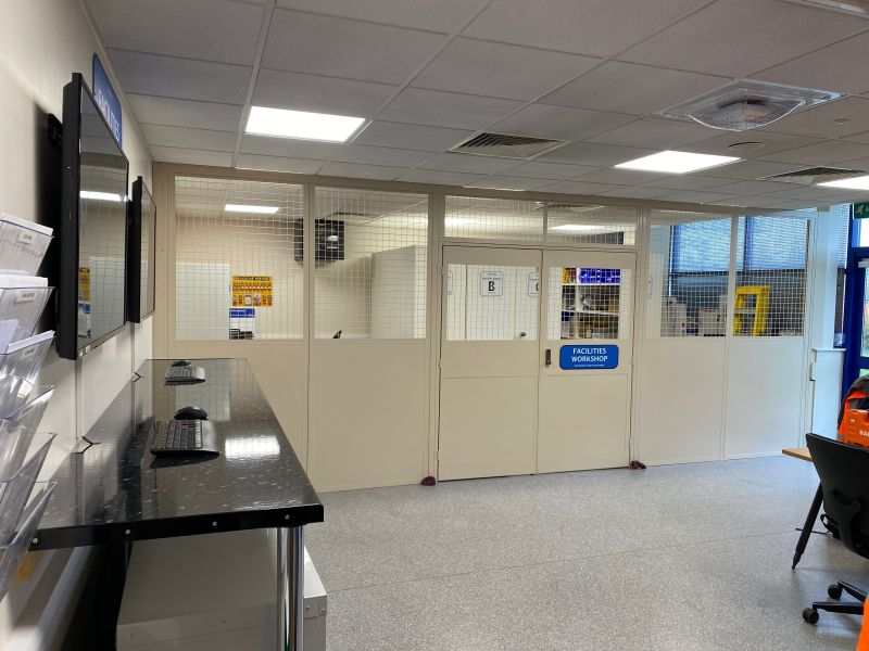 Oystashell 2 anti-ligature Wi-Fi enclosure installed in a suspended ceiling tile within a commercial facility
